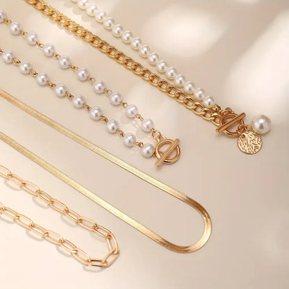 Ensemble de colliers vintage en perles et chaîne serpent en or